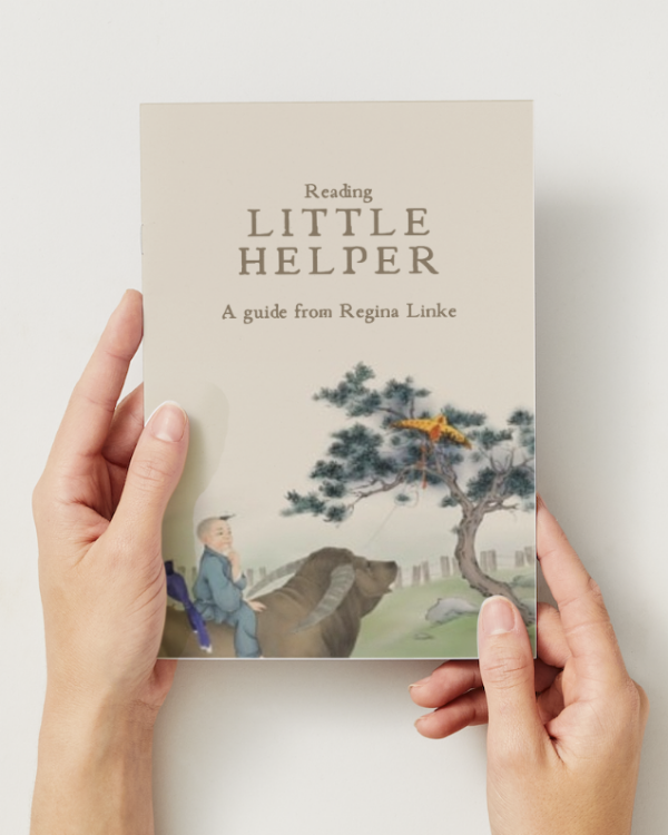 Book called Reading Little Helper a guide from Regina Linke being held by a pair of hands